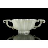 A MUGHAL STYLE WHITE JADE ‘CHRYSANTHEMUM’ TWO-HANDLED CUP China, Ming Dynasty, 16th-17th