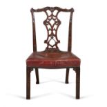 A PAIR OF GEORGE III MAHOGANY FRAMED DINING CHAIRS, in the Chippendale taste, with scroll carved