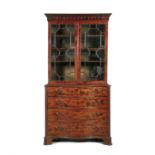 A GEORGE IV SERPENTINE FRONT BOOKCASE, the upper section with dentil and arcaded cornice,