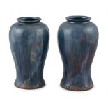 A PAIR OF CARRIGALINE BALUSTER VASES, each with blue undulating glaze. Each 23cm high