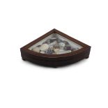 A LATE 19TH CENTURY MAHOGANY CURIO BOX, of bowed triangular form, filled with a collection of