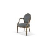 A GILTWOOD ARMCHAIR IN 'FRENCH STYLE', the circular padded back crested with carved pattera,