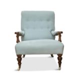 A VICTORIAN WALNUT AND BUTTON UPHOLSTER ARMCHAIR, 19th century, covered in soft blue fabric,