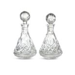 A PAIR OF WATERFORD CUT GLASS DECANTERS AND STOPPERS, modern, each tapering body cut with diamonds