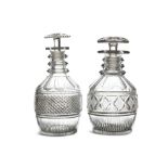 TWO EARLY VICTORIAN CUT GLASS DECANTERS, of similar design, each with mushroom stopper,