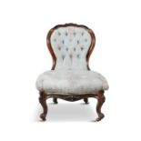 A VICTORIAN LADY'S ROSEWOOD FRAMED BALLOON BUTTON BACK SALON CHAIR, with carved crest rail and