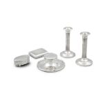 A GROUP OF SILVER OBJECTS, including a pair of circular desk candlesticks with fluted column stems,