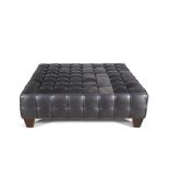 A LARGE MODERN LEATHER OTTOMAN, of square form, the panelled padded seat upholstered in brown