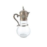 AN ENGRAVED GLASS AND EPNS MOUNTED BEER JUG, 20th century, the cover with figural top above a