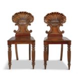 A PAIR OF 19TH CENTURY MAHOGANY HALL CHAIRS, by Gillows of Lancaster, with carved scallop shell