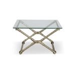 A BRASS TUBULAR FOLDING 'X' FRAME COFFEE TABLE, with a rectangular plate glass top. 64.5 x 55.