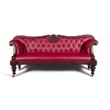 A GEORGE IV MAHOGANY FRAMED SCROLL-END BUTTON BACK SOFA, the serpentine back with carved central