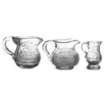 A COLLECTION OF THREE IRISH CUT GLASS JUGS, comprising a late Georgian example, of baluster shape,