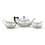 A SILVER THREE PIECE OVAL TEA SERVICE, Sheffield, c.1949, mark of Edwin Viner, comprising a teapot,