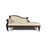 A WILLIAM IV MAHOGANY FRAMED CHAISE LONGUE, upholstered in cream leather fabric, on lotus carved