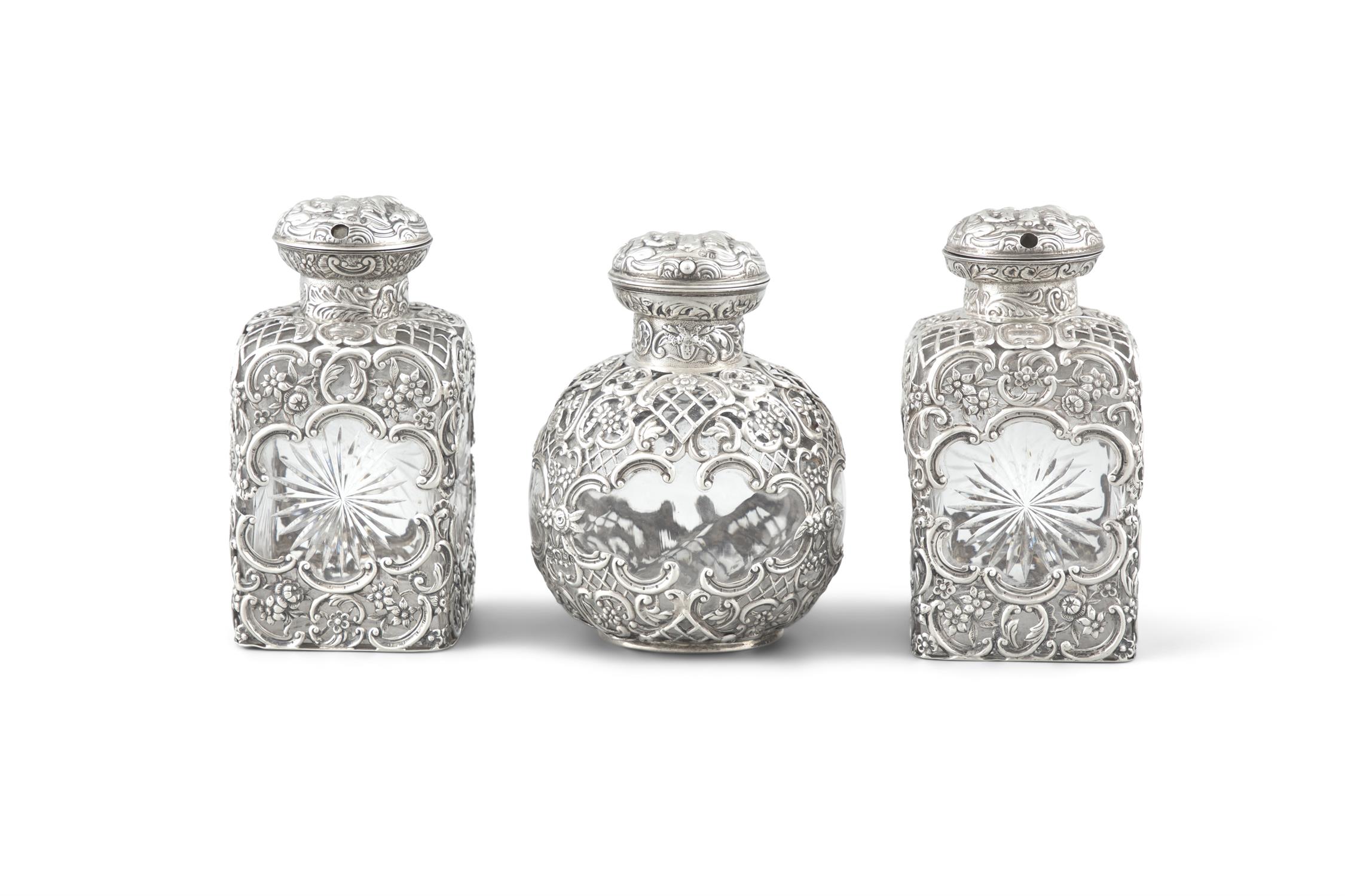 THREE VICTORIAN SILVER OVERLAID AND GLASS PERFUME FLASKS, London, c.1893/1897, with mark of