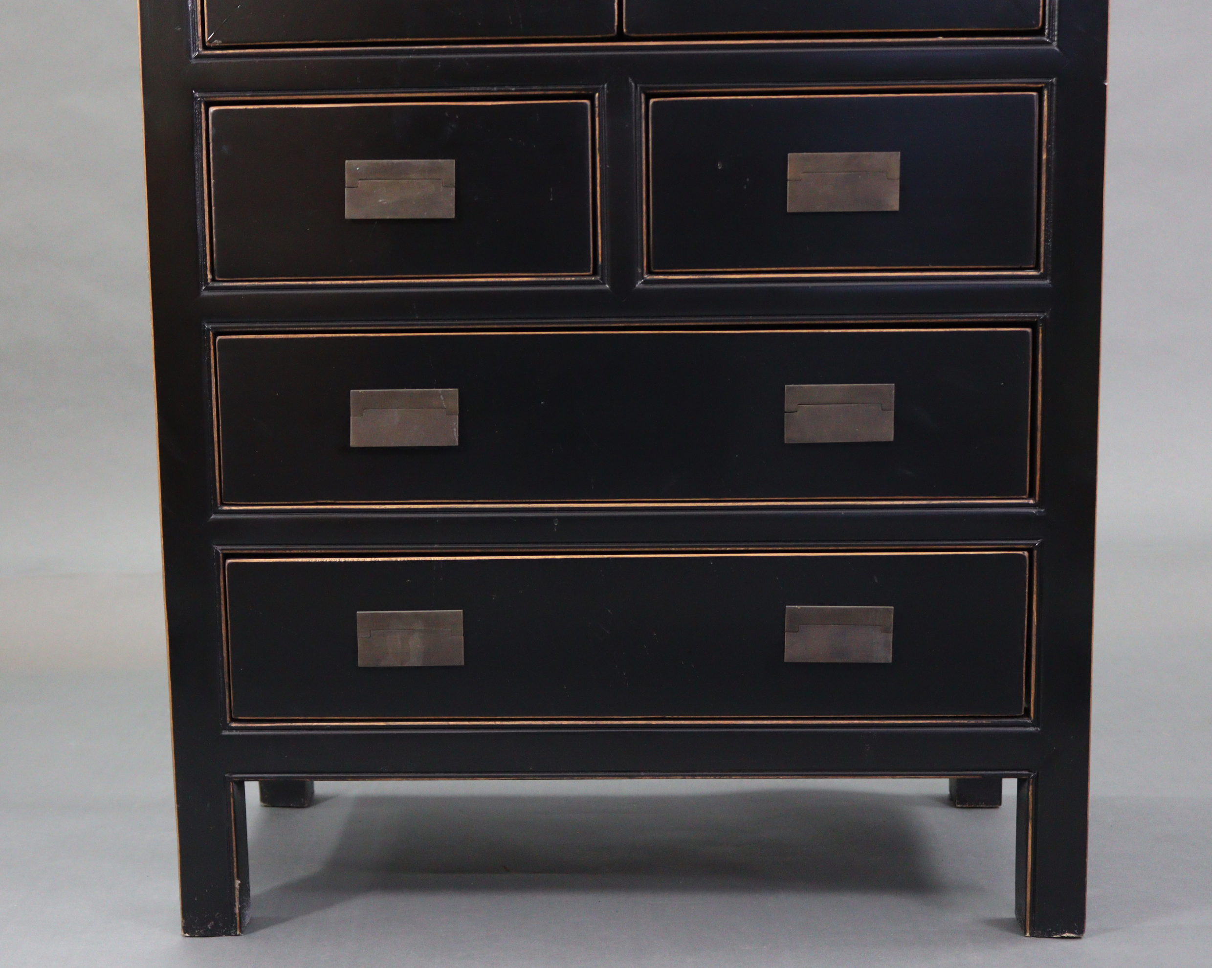 A Chinese style black & gold lacquered wardrobe, enclosed by pair of panel doors above two short & - Image 4 of 7