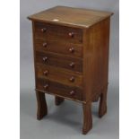 A mahogany small upright chest fitted five long drawers with turned knob handles, & on shaped