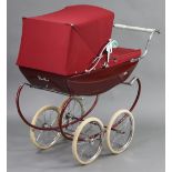 A Silver Cross coach-built doll’s pram (crimson), 36” long; & a celluloid baby doll.