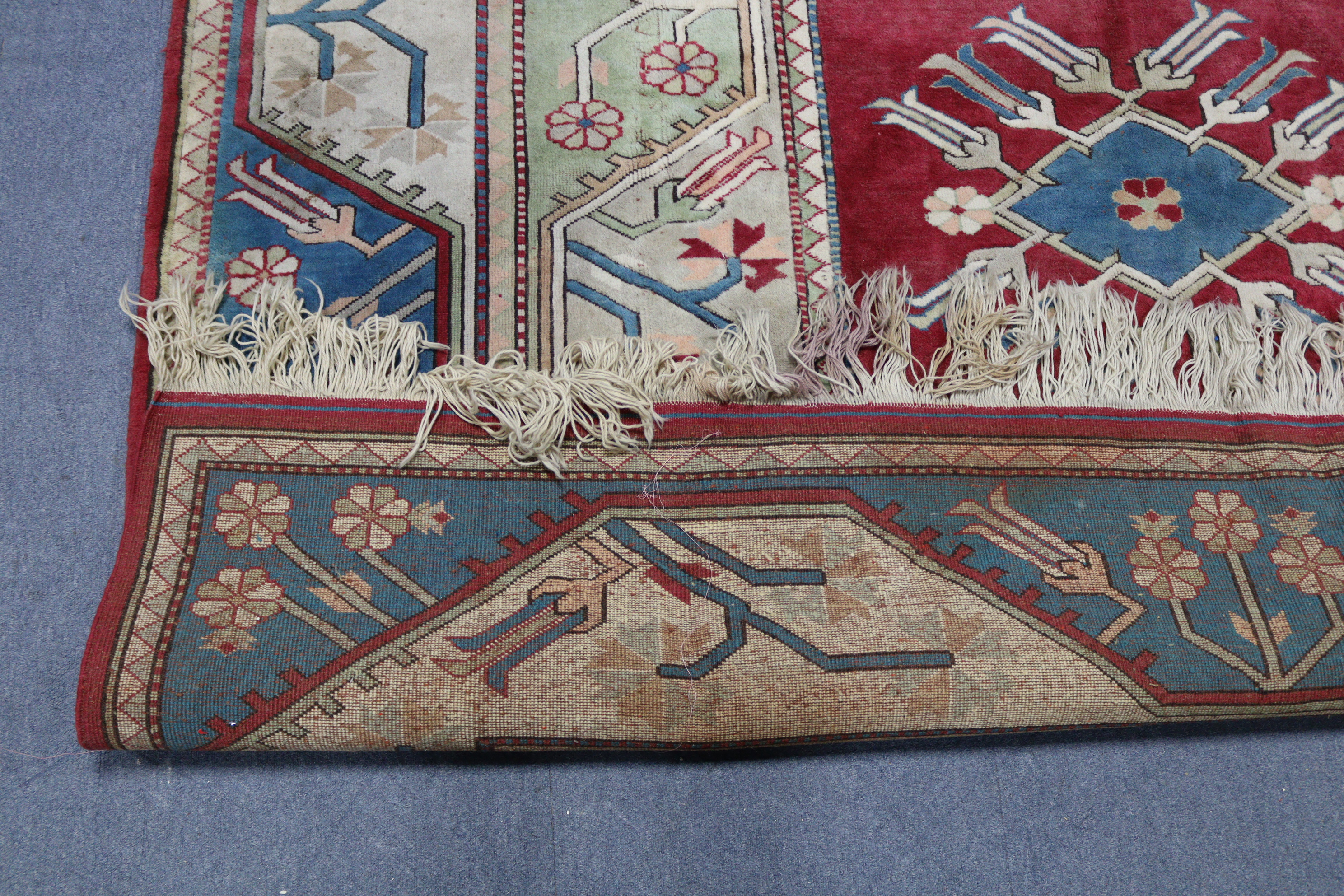 A Turkish small carpet of crimson, blue & ivory ground, with repeating geometric design to centre - Image 2 of 2