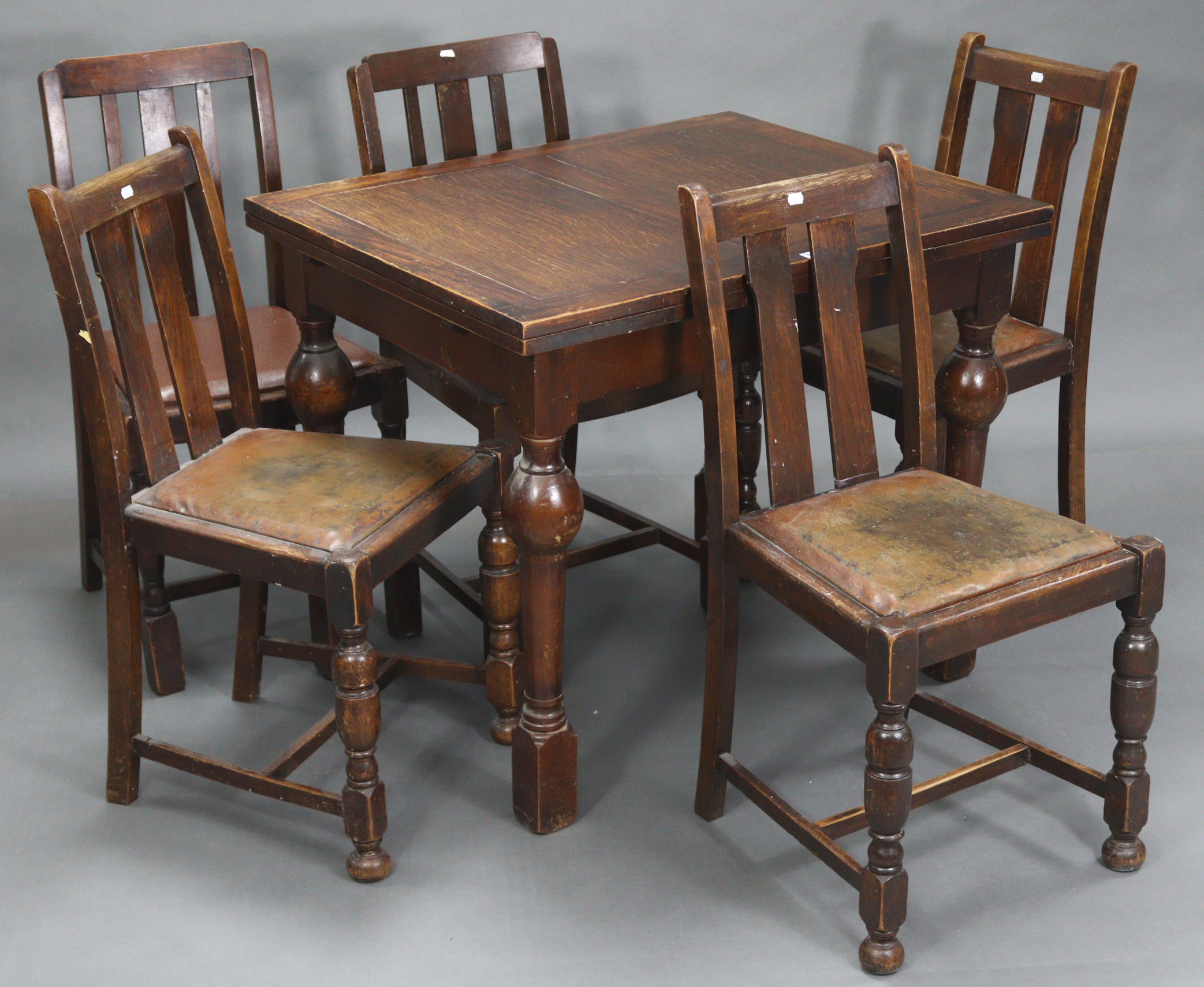 A mid-20th century oak draw-leaf dining table on four bulbous-turned legs, 29½” x 53¼” (open), & a