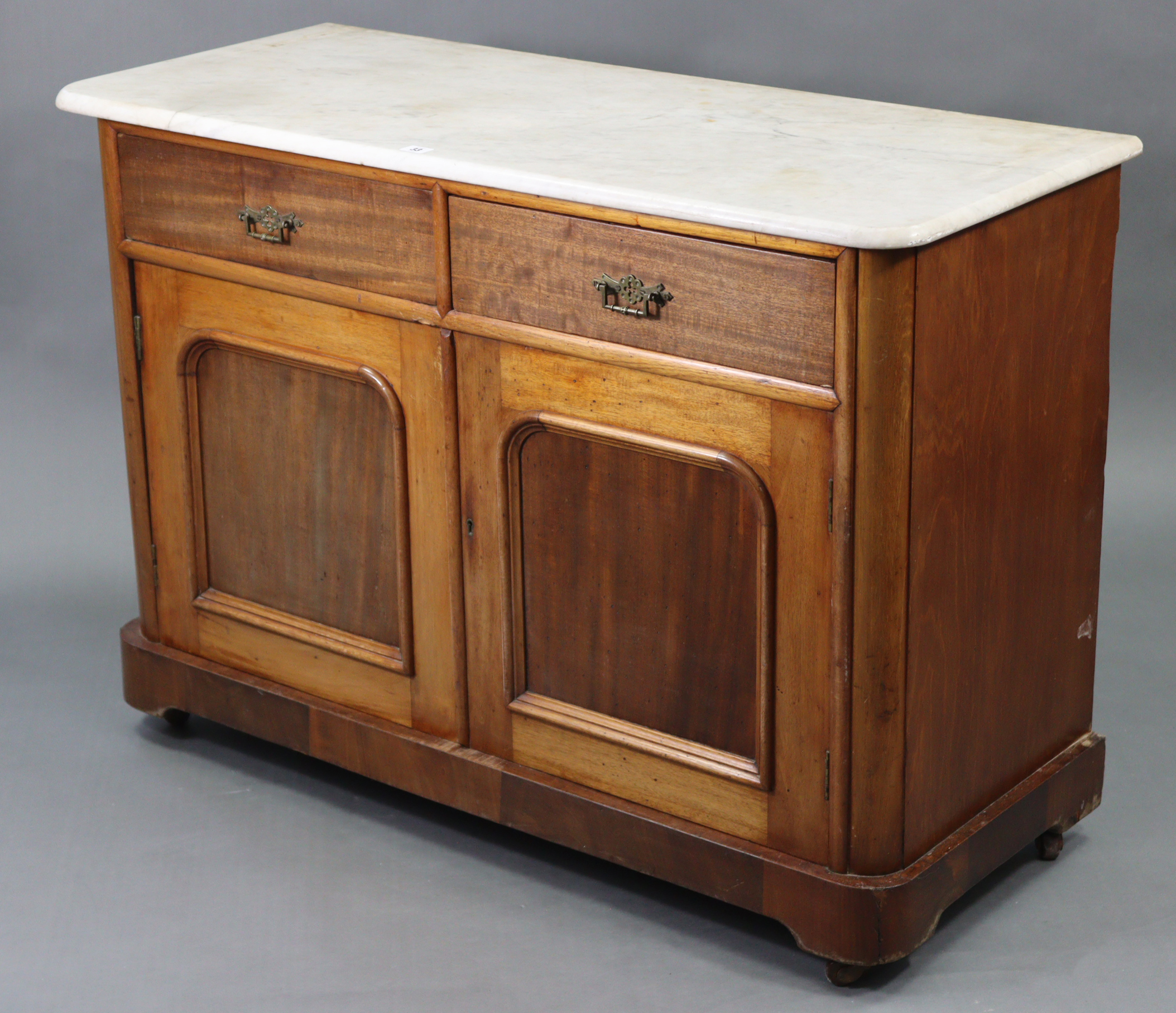 A Victorian mahogany marble-top washstand inset tiles to the stage-back, fitted two frieze drawers