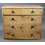 A pine chest, fitted two short & three long graduated drawers with turned knob handles, 41¾” wide