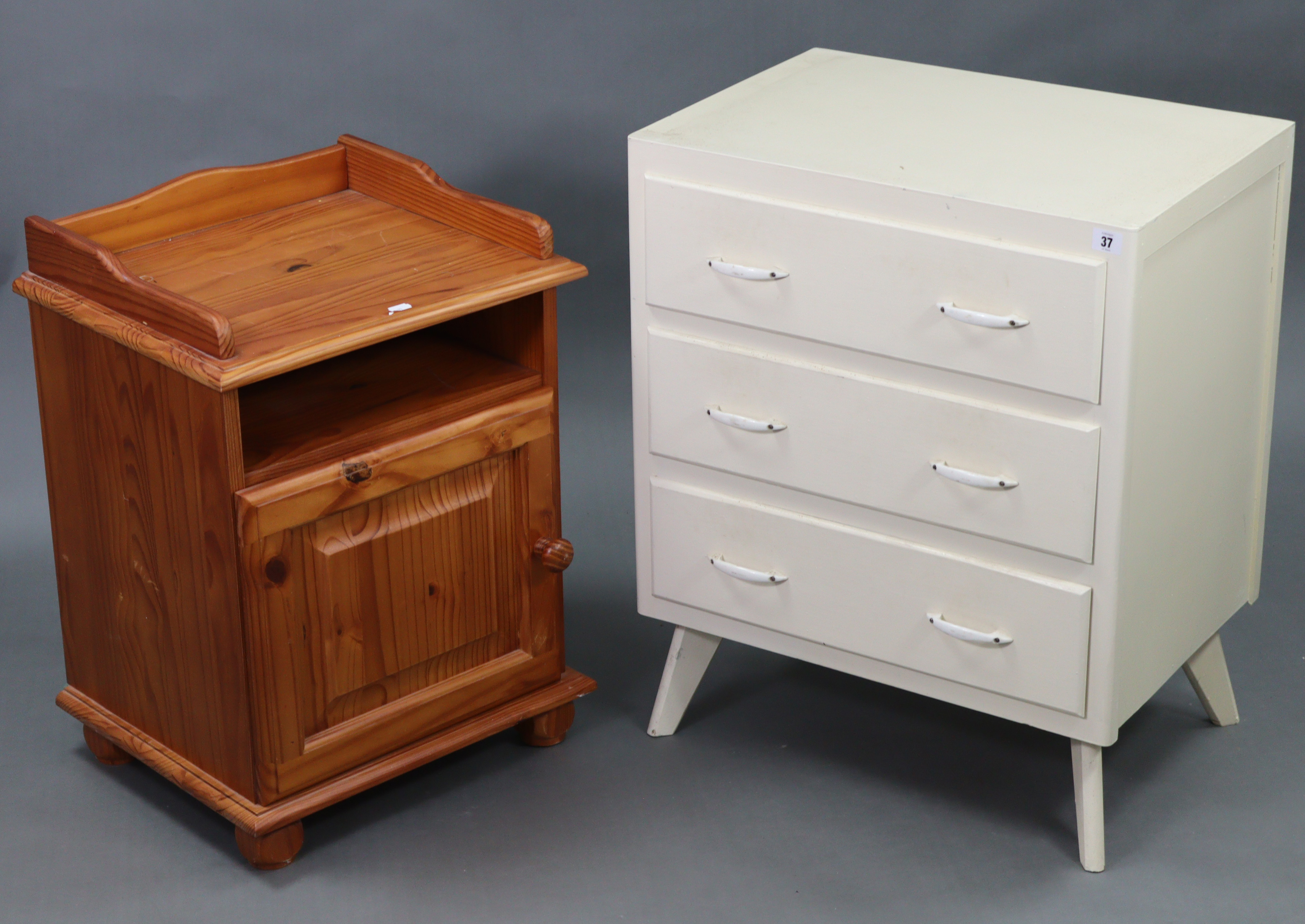 A white painted wooden small chest fitted three long drawers, & on splay legs, 23½” wide x 28½” high