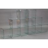 A pair of contemporary tempered-glass side units each comprising of six cubic sections, 37½” long