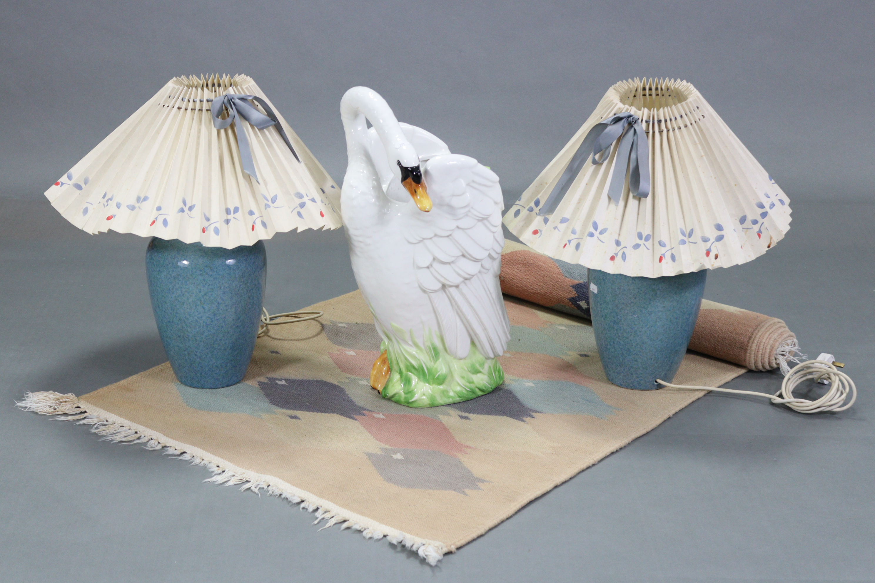 A pair of blue glazed ceramic ovoid table lamps, with shades; together with a novelty ceramic “Swan”