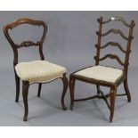 A Victorian rosewood dining chair with kidney-shaped back, padded seat, & on slender carved cabriole