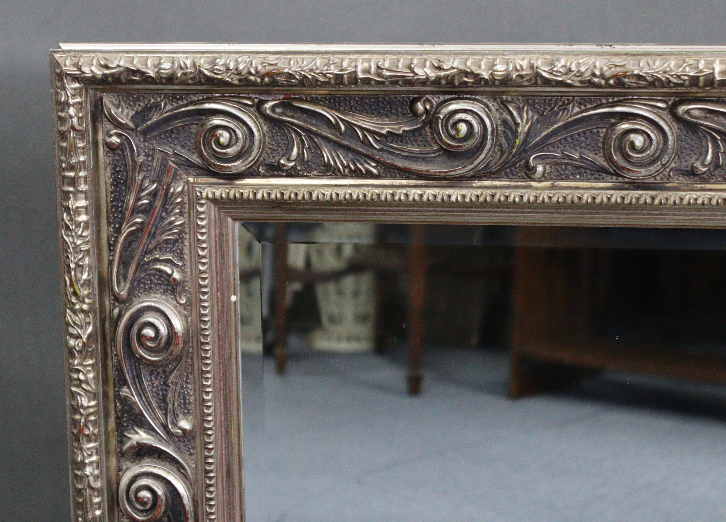 A large rectangular wall mirror with silvered ornate frame, & inset bevelled plate, 32” x 43½”. - Image 2 of 2