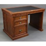 A stained pine office desk, inset black leatherette to the rectangular top, fitted two brushing