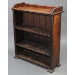 A Victorian walnut tray-top three-tier standing open bookcase, on carved block feet, 33” wide x
