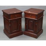 A pair of mahogany-finish bedside cabinets, each fitted frieze drawer above cupboard enclosed by