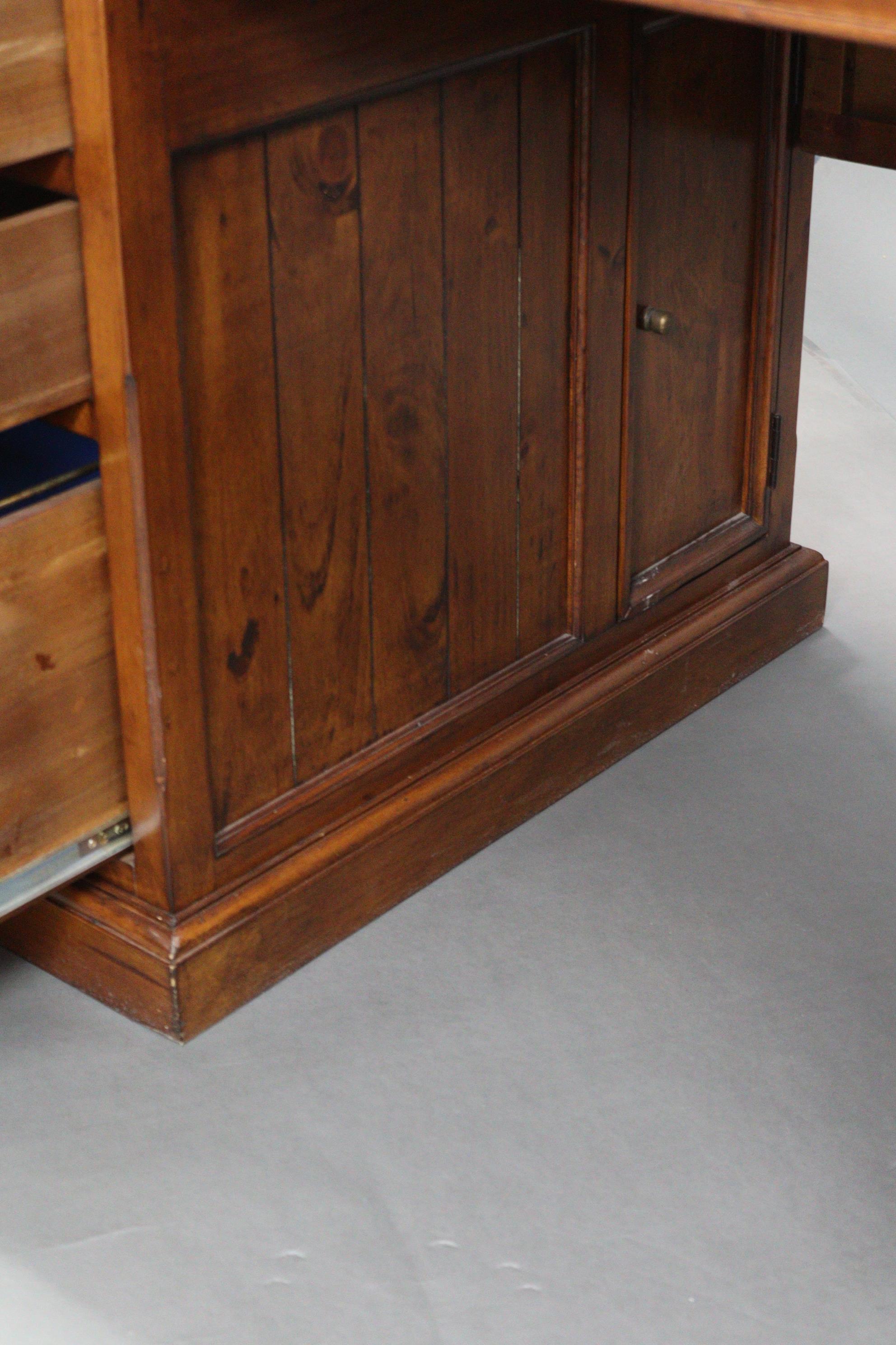 A stained pine office desk, inset black leatherette to the rectangular top, fitted two brushing - Image 6 of 7