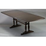 An Ercol extending dining table with rectangular top, three additional leaves, pull-out action, &