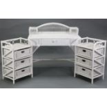 A white painted wicker dressing table fitted centre frieze drawer, & on round legs, 40” wide x