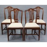 A set of four Georgian style mahogany splat-back dining chairs, with padded drop-in seats & on