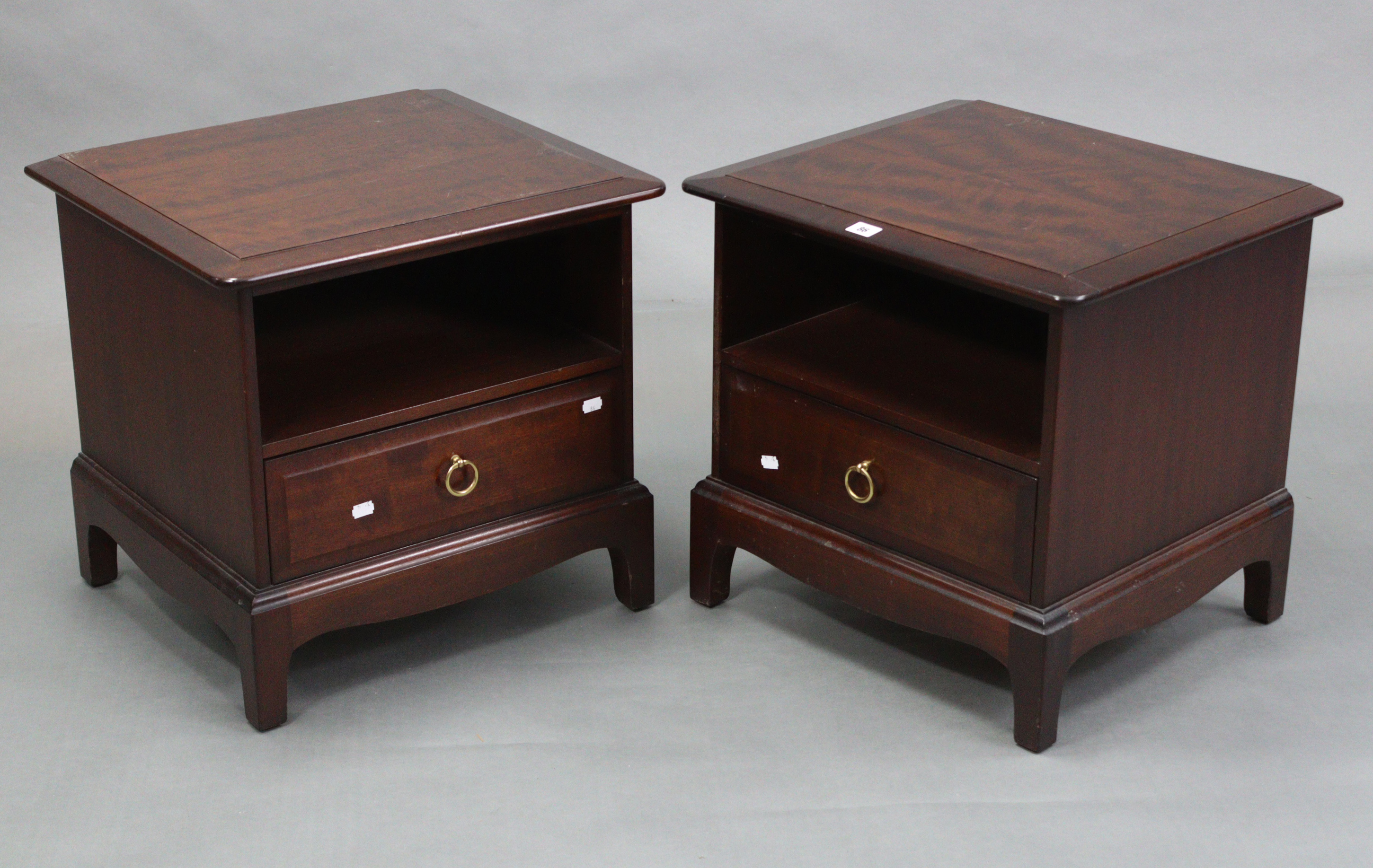 A pair of Stag “Minstrel” mahogany-finish bedside cabinets, each with open recess above a long