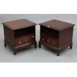 A pair of Stag “Minstrel” mahogany-finish bedside cabinets, each with open recess above a long