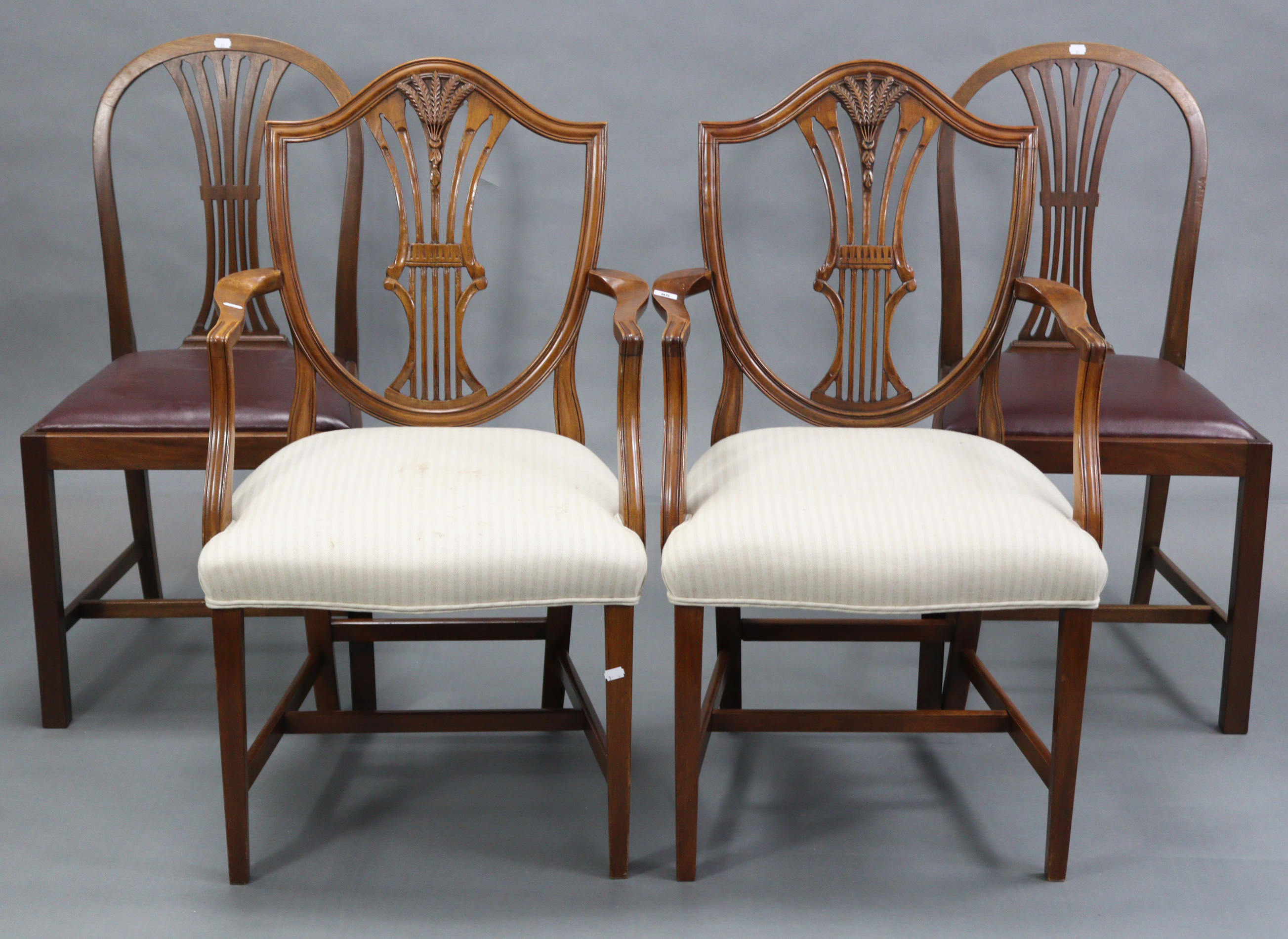 A pair of Georgian style mahogany carver dining chairs, with wheat-sheaf design to the shield