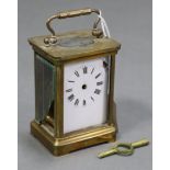 A brass cased carriage clock (w.a.f.), 4¼” high.