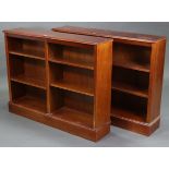 A pair of mahogany-finish standing open bookcases, each with four adjustable shelves & on plinth
