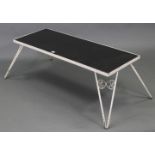 A white painted wrought-metal rectangular low conservatory coffee table on four triangular shaped