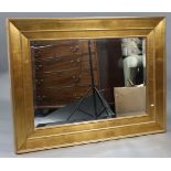 A large gilt frame rectangular wall mirror inset bevelled plate, 35½” x 47½”.