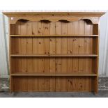 A pine dresser top fitted three open shelves & with panelled back, 58” wide x 40½” high x 7½” deep.