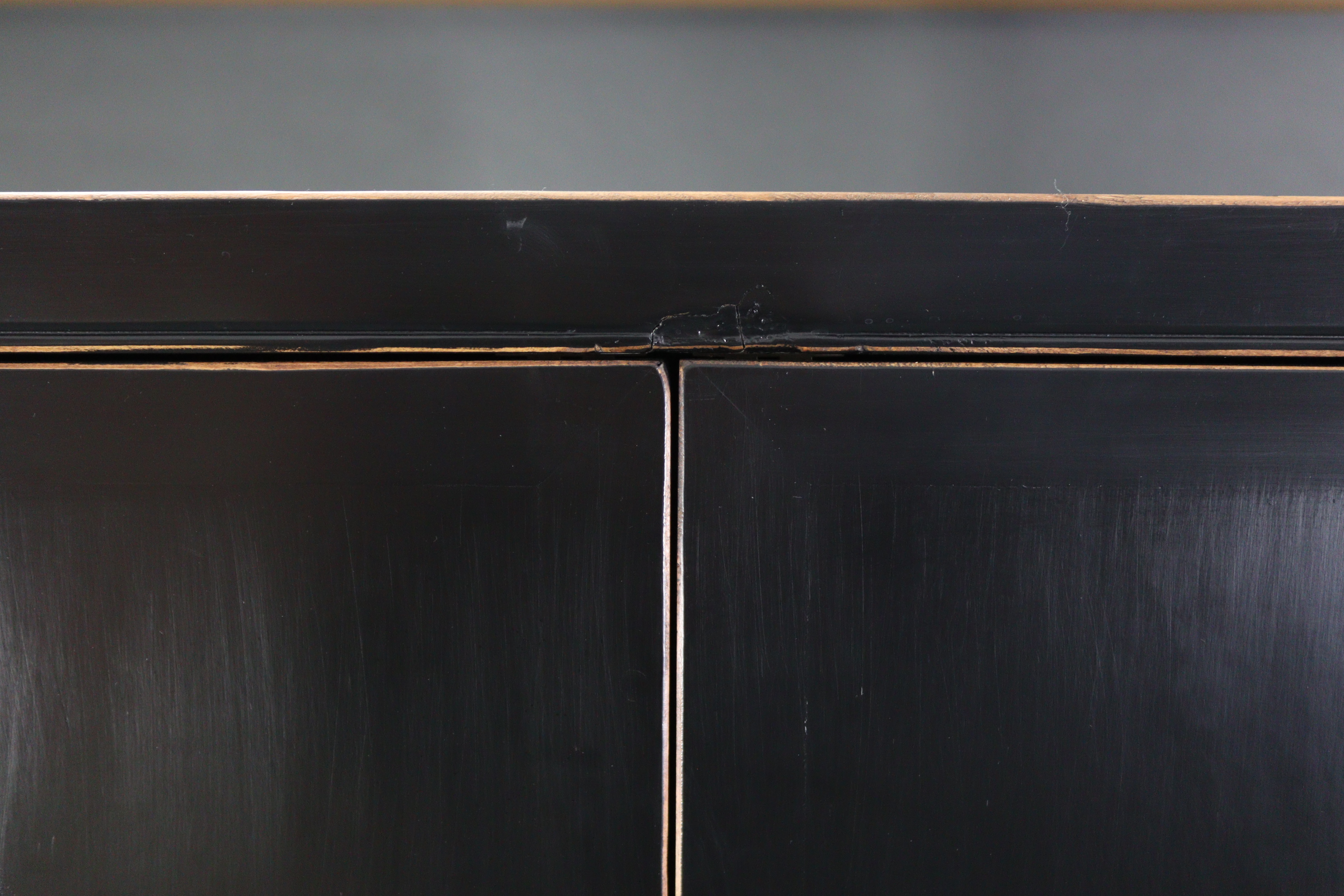 A Chinese style black & gold lacquered wardrobe, enclosed by pair of panel doors above two short & - Image 7 of 7