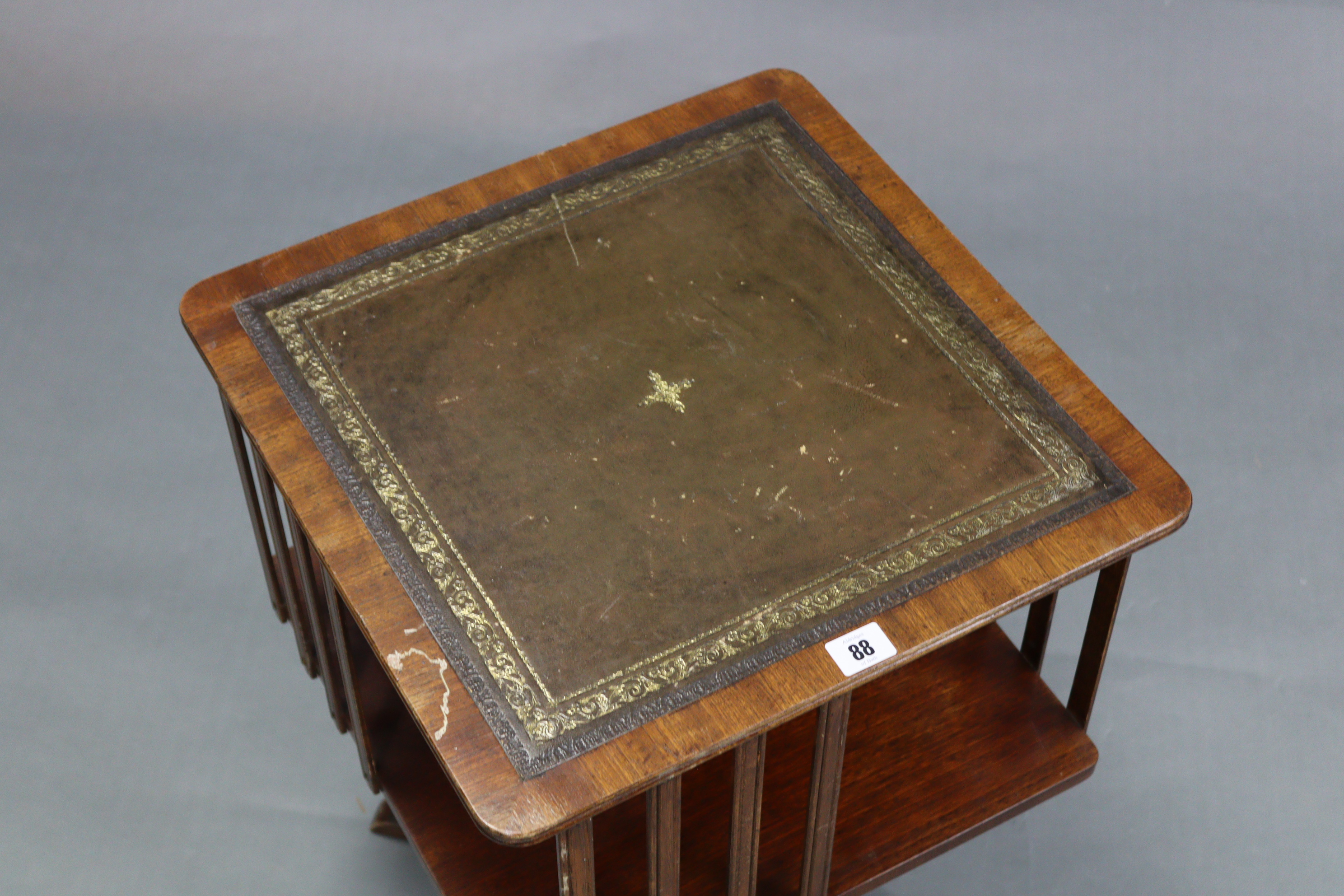 A reproduction mahogany table-top revolving bookcase inset gilt-tooled green leather, & on vase- - Image 2 of 3