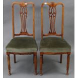 A pair of late 19th/early 20th century inlaid-mahogany splat-back occasional chairs with padded